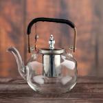 Elegant glass teapot with Silver infuser and wooden handle
